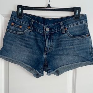 Levi’s jean short with raw hem, size 26.